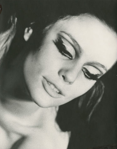 Black-and-white photograph of a woman's face and shoulders.