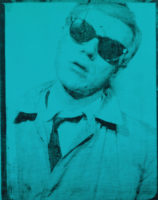 A screen print of Andy Warhol's face and chest. He has short, light hair and is wearing a light-colored shirt with a dark tie, a light-colored jacket and dark sunglasses. His head is tilted to the right and his mouth is slightly open. There is a blue tint to the entire screenprint.
