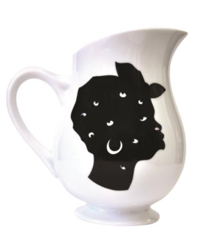 White ceramic pitcher featuring a woman's face in profile in black ink.