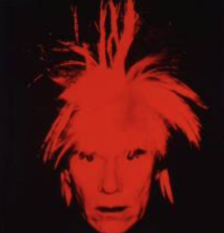 A screen printed portrait of Andy Warhol. His hair and face are bright red, and the background is black.