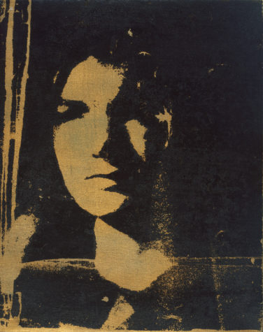 A screenprint of a profile of a woman's face in gold and black.