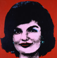 A screenprint of a person's face closeup on a red background.