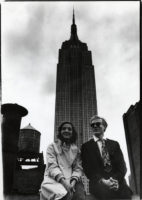 Black and white photograph of Andy Warhol and Marisol with the Empire State Building in the background.