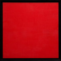 A square canvas painted red in a black frame.