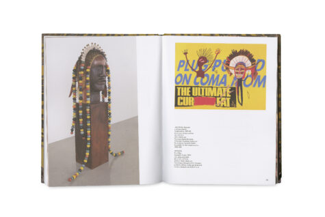This image shows an open book with pages displaying colorful art. On the left, there is a photograph of a large sculpture adorned with beads and a decorative headpiece. On the right, there is a graphic artwork by Jean-Michael Basquiat and Andy Warhol. The artwork includes various colors and abstract designs.